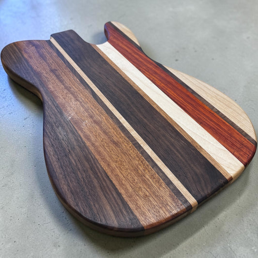 Wooden cutting board with "Asbury Park" engraved, made by Covered Bridge Workshop, showing a smooth surface and natural wood grain.