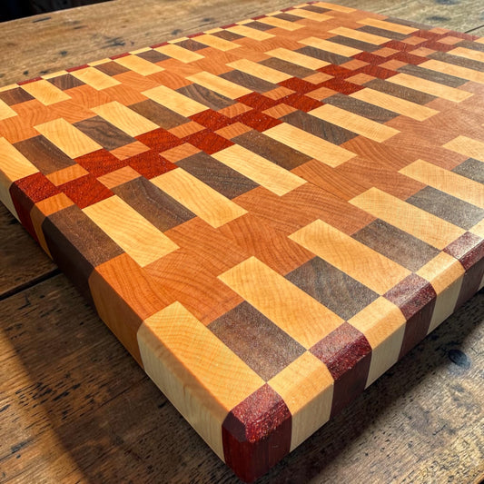 Wooden cutting board titled "Dream On" by Covered Bridge Workshop, showing a smooth surface with engraved design.