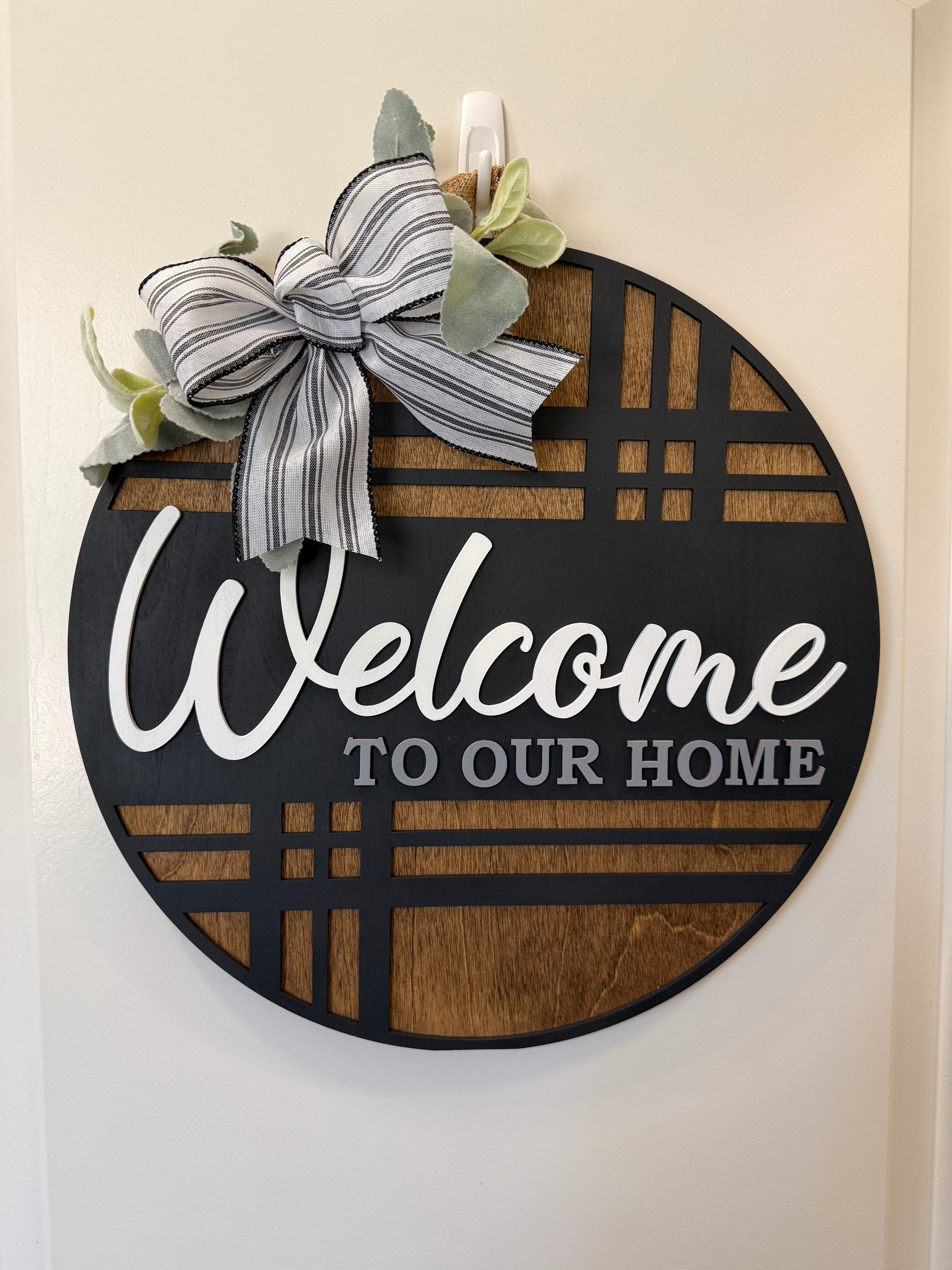 Modern plaid door hanger with "Welcome" message from Covered Bridge Workshop, perfect for front door decor.