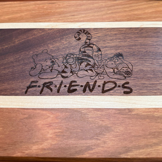 Decorative Pooh & Friends serving tray by Covered Bridge Workshop with colorful character illustrations on a wooden surface.