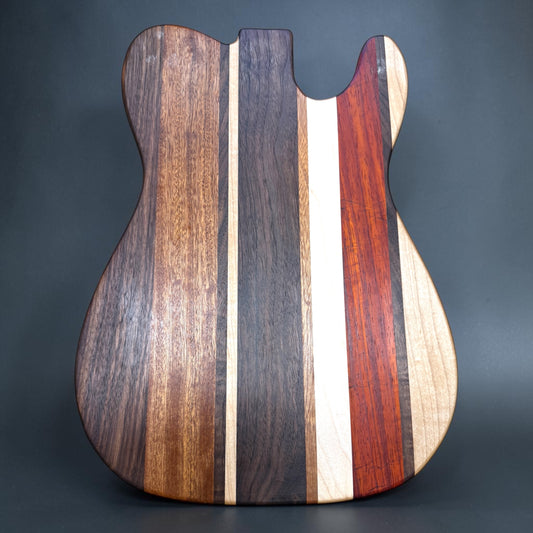 Wooden cutting board labeled "Asbury Park" by Covered Bridge Workshop, featuring a natural wood grain finish.