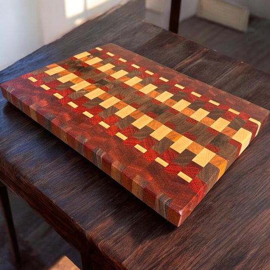 Wooden cutting board with Tequila Sunrise design from Covered Bridge Workshop, featuring colorful sunrise artwork on a sleek surface.
