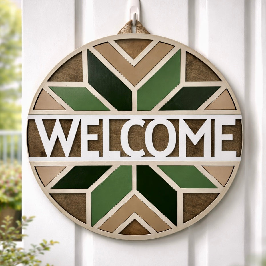 Decorative 'WELCOME' sign with geometric pattern on a white wooden background