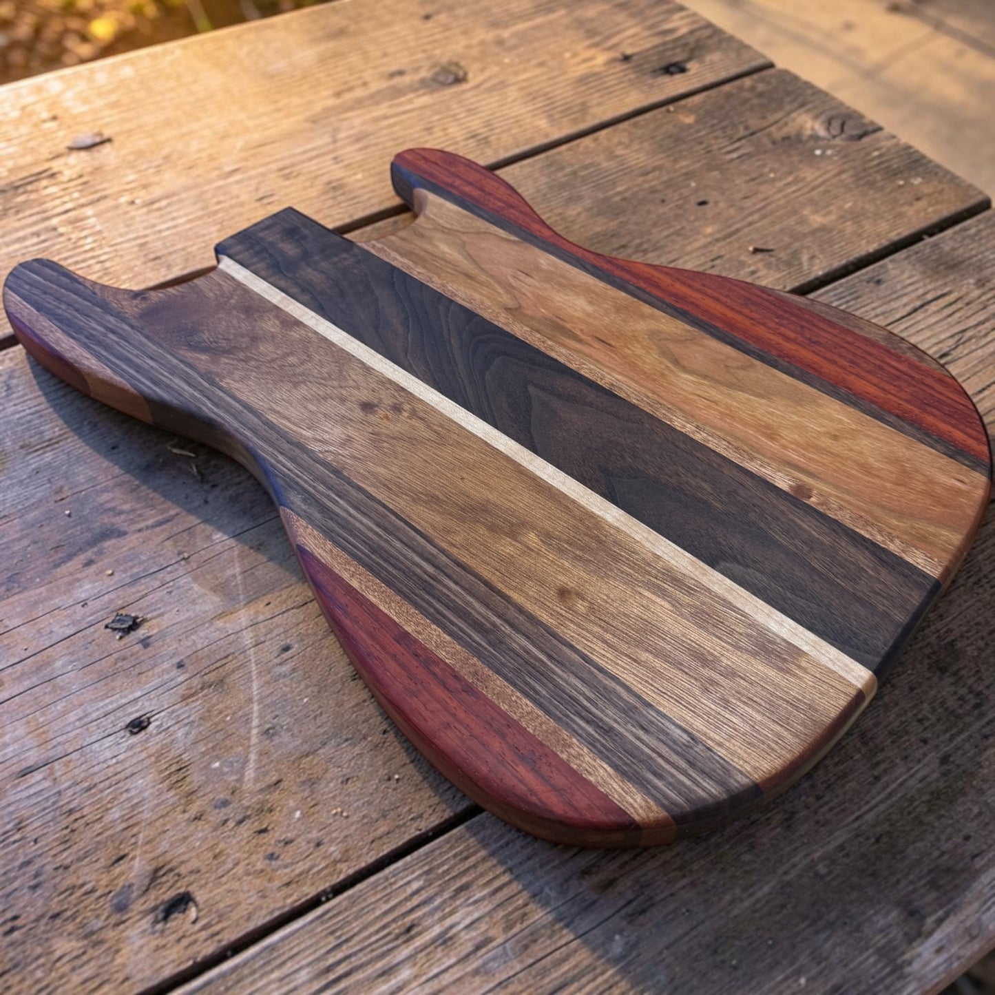 Wooden cutting board featuring "SRV Strat" design by Covered Bridge Workshop, ideal for kitchen prep and decorative display.