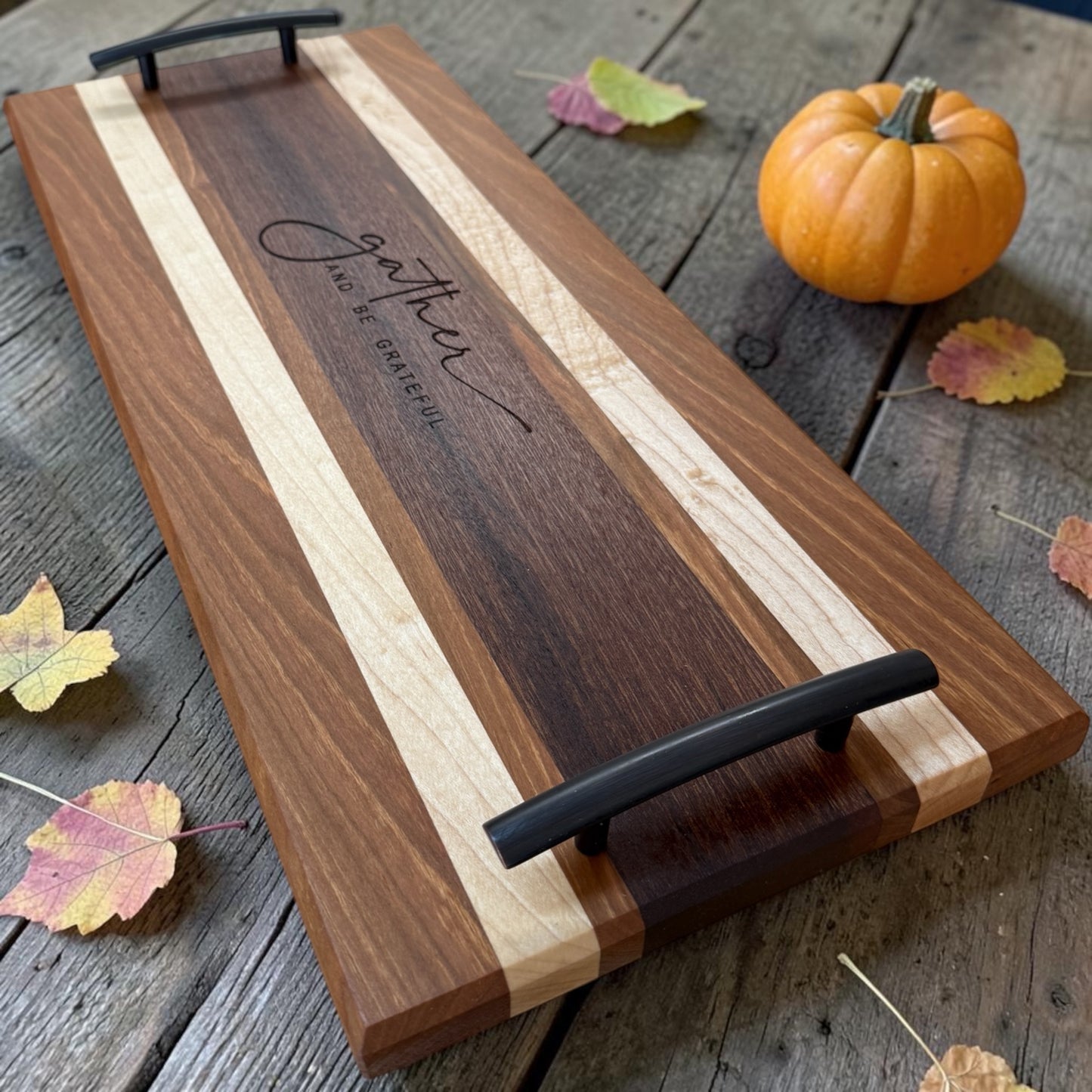 Wooden serving tray with "Gather" inscription by Covered Bridge Workshop, perfect for serving food and beverages.