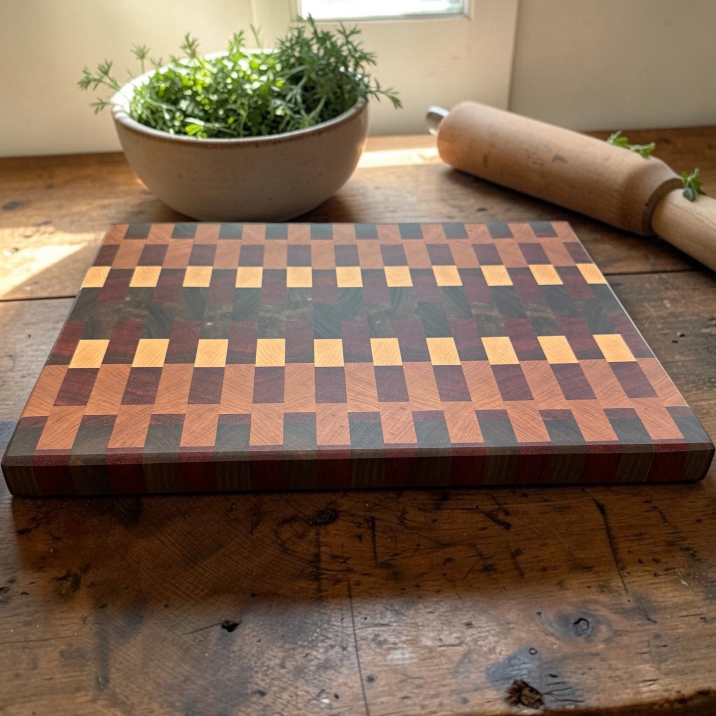 Wooden cutting board by Covered Bridge Workshop, featuring a smooth surface and natural wood grain for kitchen prep.