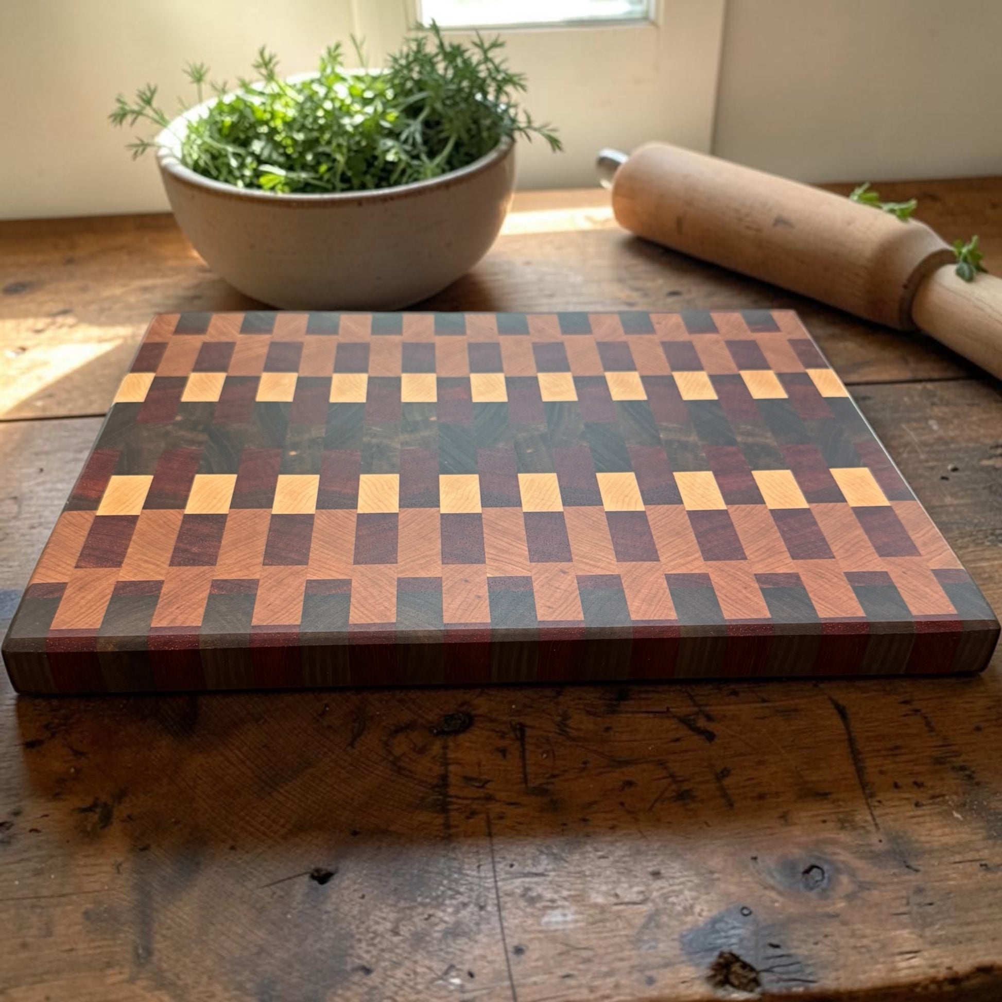 Wooden cutting board by Covered Bridge Workshop, featuring a smooth surface and natural wood grain for kitchen prep.