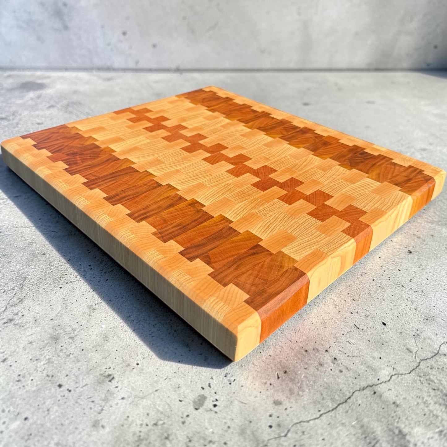 Wooden cutting board featuring firefly design from Covered Bridge Workshop, with a smooth surface and natural finish.