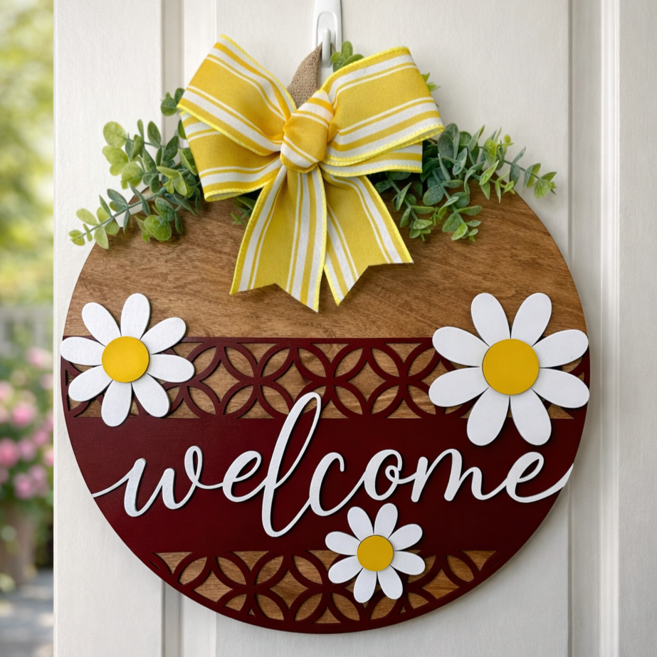 Decorative door hanger with a welcoming Daisy II design by Covered Bridge Workshop, featuring floral and greenery accents.